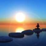 3D render of a female in a yoga pose on stepping stones in the ocean at sunset